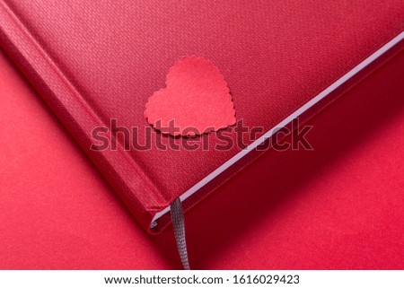 Note book on red background