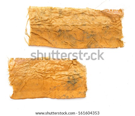 a piece of gold cloth on a white background