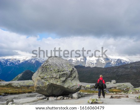 The tourist starting to climb the Trolltunga, Norway.