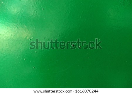 Shinny green painted metal background wallpaper. Close up view. Royalty-Free Stock Photo #1616070244