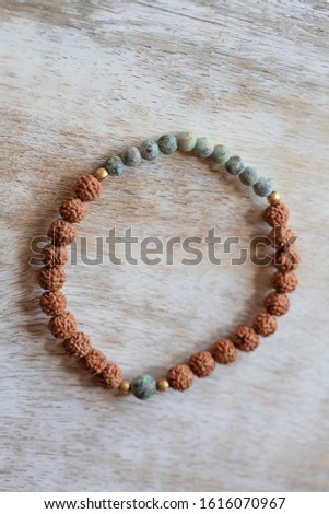 natural mineral stone beads yoga bracelet on natural wooden background