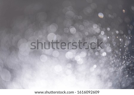 Abstract bokeh from light and water spray in backgrounds of various colors