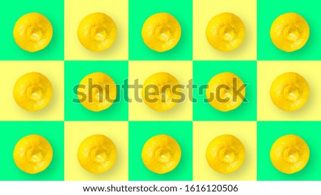 An abstract picture of lemons on a yellow-green background made of squares for each element of the picture.