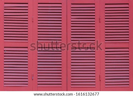 Vintage red colour window, Outdoor classic louver window with horizontal wooden pattern, Texture background.