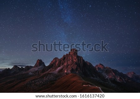 beautiful night panoramic mountain view of Dolomites Alps, Italy. starry sky and  milky way. natural background