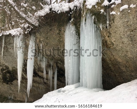 Frozen waterfall during the swiss winter in Kemptnertobel - frozen water