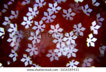 Snowflakes bokeh lights. Abstract christmas background with bright snowflakes