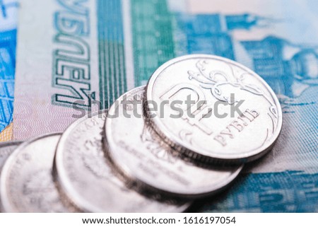 Russian money for financial and economic news illustration and backgrounds. Coins with symbol of russian currency and various bills