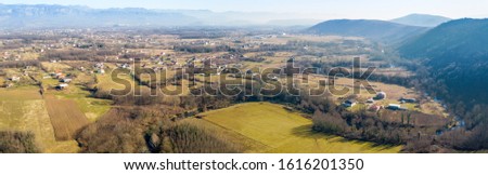 Aerial footage over small village and the mountains, near the city of Danilovgrad in Montenegro.