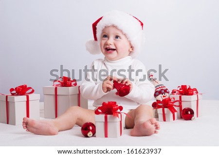 Christmas photo.  Baby with gifts.