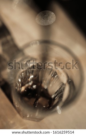 Espresso is poured into a coffee glass. Nice symbol image for coffee preparation.