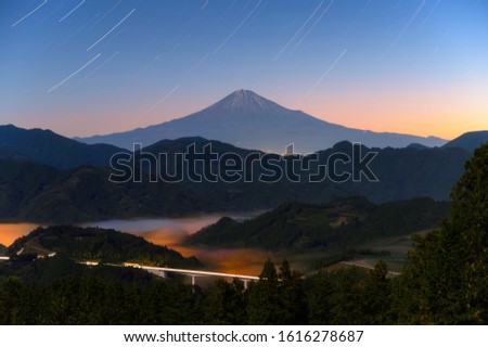 Mt. Fuji with star trail at night, long exposure image of Fuji mountain in Shizuoka, Japan