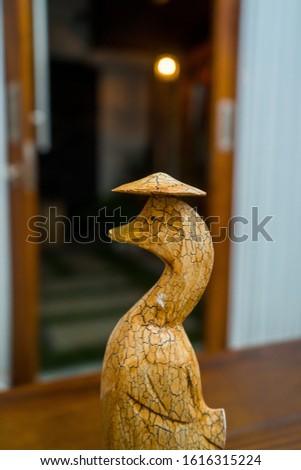 Partial and selective focus image the group of wooden duck statues. Photographed in close range, suitable for decoration and souvenirs.