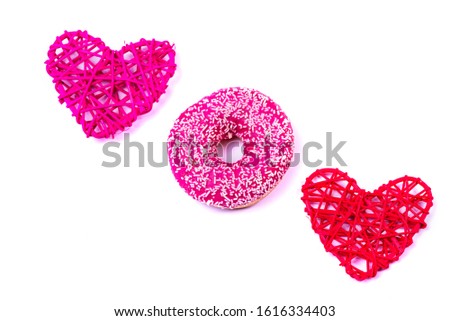 Donut and hearts isolated on a white background. Delicious fresh pastries.