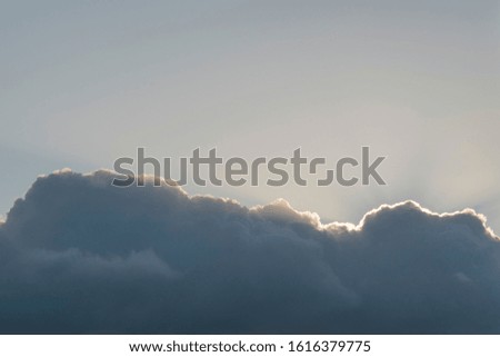 Fragment of the evening sky with clouds at sunset