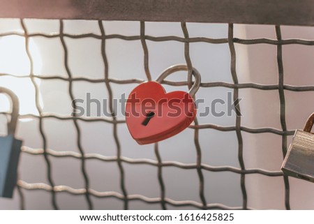 Red heart with keyhole. Metal lock Valentines day background. Concept of love, romantic relationship and fidelity. Copy space for your text