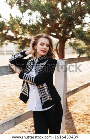Beautiful picture of young woman in the equestrian club.photo portrait of a young horsewoman