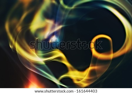 Abstract colorful smoke on a black background