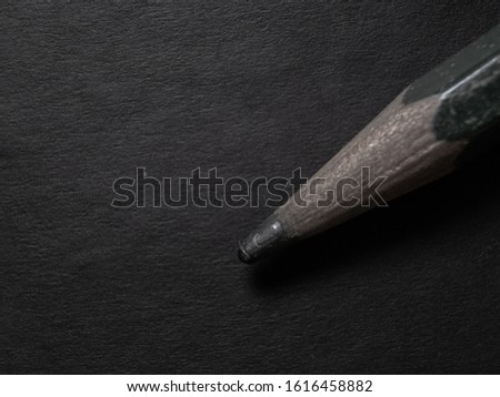 Pencil macro shot isolated on black  for wallpaper or quotes background 