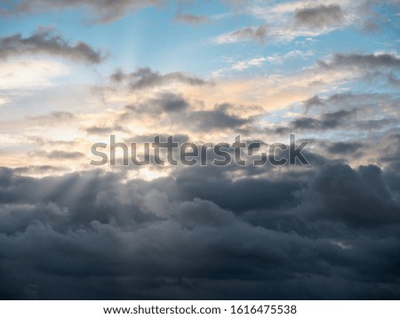 sky view with clouds and rays of light