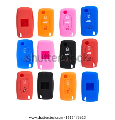 silicone cases for a keychain from the car alarm. Color silicone casing for remote car keys isolated on white background. Remote key case, colorful car, many shapes. on White background. 