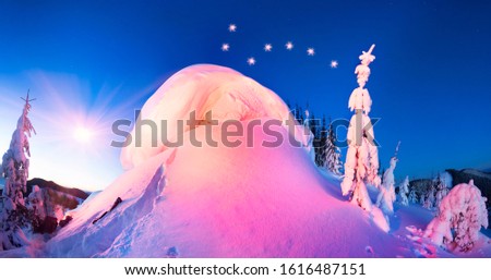 snow cornice at the top is a snow formation formed in the mountains under the influence of wind. Artistic illumination has created a fabulous fiction picture Big Dipper