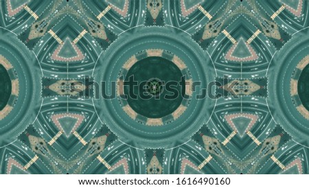 Kaleidoscopic effect aerial top shot of a city roundabout