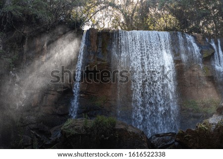 Sunlight beaming through Waterfall, Nature Scape and Relax concept