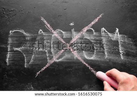 crosses the inscription racism. anti-racism concept, stop racial issues Royalty-Free Stock Photo #1616530075