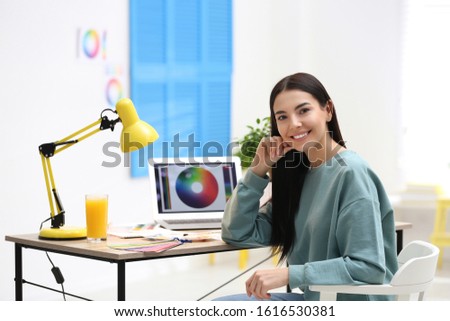 Portrait of female designer in office. Creative profession