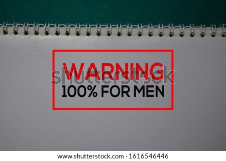 Warning 100% For Men write on a book isolated on green background.