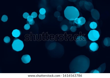 Bokeh of lights blue on black background, modern concept.