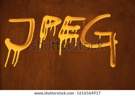 JPEG word painted on rusty metal wall. image, photo  format