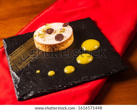 lemon tart with chocolate  in the restaurant