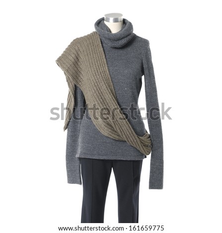 female shirt dress with scarf and trousers isolated on a dummy  
