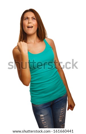 woman is experiencing success luck but shows a sign in a blue shirt and jeans isolated in studio