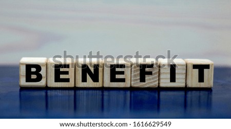 concept word benefit on wooden cubes on a beautiful background