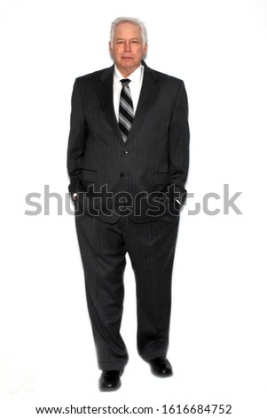 Business Man. A business man in a pin striped suit. Isolated on white. Room for text. Clipping Path. Business men world wide create and run businesses and keep the world of business running.  Royalty-Free Stock Photo #1616684752