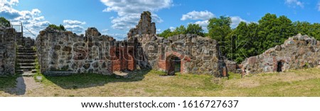 Panorama of ruins of the medieval Bishop’s Castle on the former island of Kuusisto in Kaarina, Finland, near Turku, at sunny summer day. Royalty-Free Stock Photo #1616727637