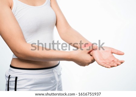 Young women paining in wrist hand on white background