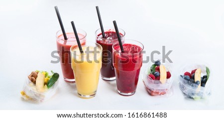 Htalthy fresh fruit and vegetable smoothies with assorted ingredients served in packs. Panorama, banner