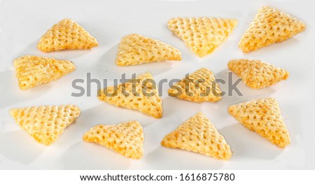 Crispy and crunchy Salty wheat 3d Triangle shape, Papad, tri angle corn puff, fryums or frymus, snack food, Indian Pouch Packing Street Food, selective focus - Image Royalty-Free Stock Photo #1616875780