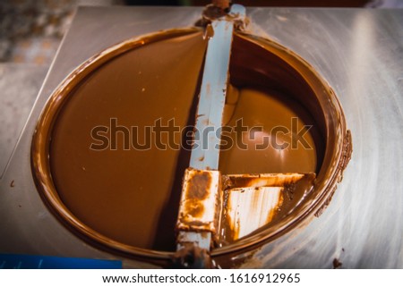 Making Natural Chocolate Cocoa liquid in Roatan Island. Honduras