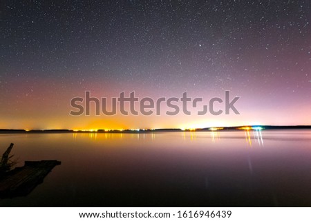 Starry sky background picture of stars in the night sky and the Milky Way. Starry sky over the lake.