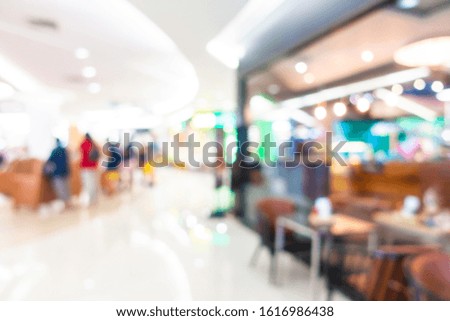 Abstract blur shopping mall in department store interior for background