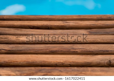 Empty wood table top on blur sea.  spring, summer or any season