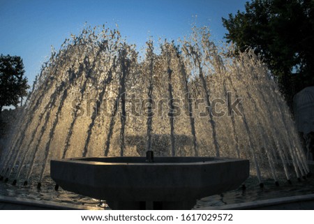 photo of a fountain taken in reverse light