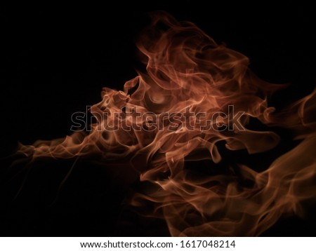 picture of fire in the night at Delhi with the shape of dragon or duck