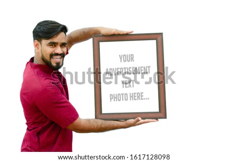young boy holding a empty(blank) white paper poster with wooden photo frem advertisement poster or business concept for graphics or poster design  [Outdoor or Print Advertising]