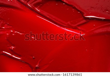 Smear and texture of red lipstick or acrylic paint. - Image